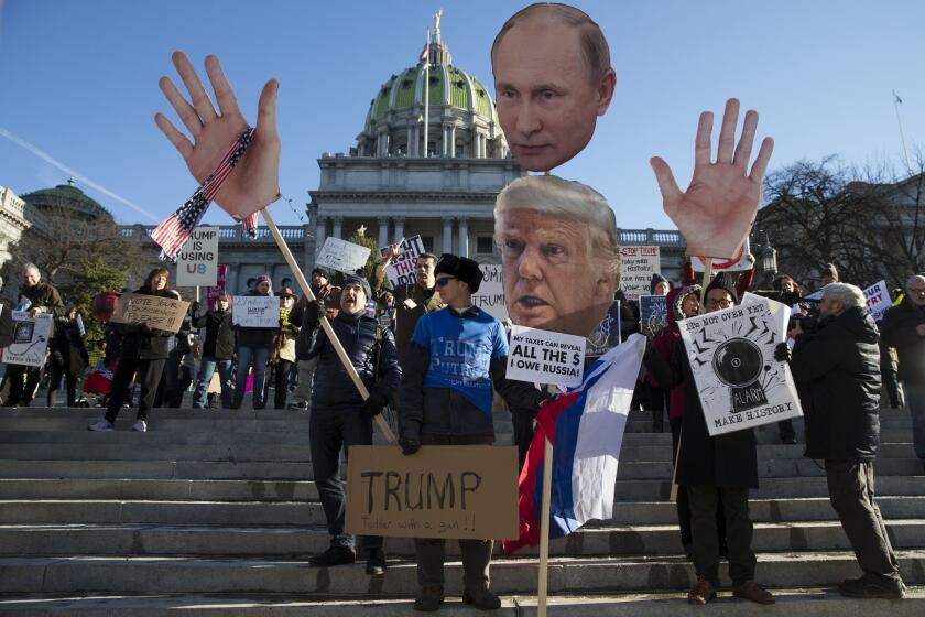 FILE - In this Dec. 19, 2016 file photo, protesters demonstrate ahead of Pennsylvania's 58th Electoral College at the state Capitol in Harrisburg, Pa. After the election that saw the winner of the popular vote fall short of the U.S. presidency, legislators in states including Connecticut, Pennsylvania, Ohio and New Mexico said they plan to introduce legislation that would require their state's Electoral College voters cast ballots for the presidential candidate who earns the most votes nationwide, regardless of the statewide results. (AP Photo/Matt Rourke, File)