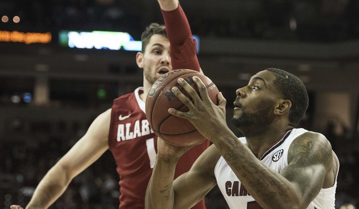 South Carolina guard Sindarius Thornwell (0) looks to shoot against Alabama guard Riley Norris (1) during the first half Tuesday.