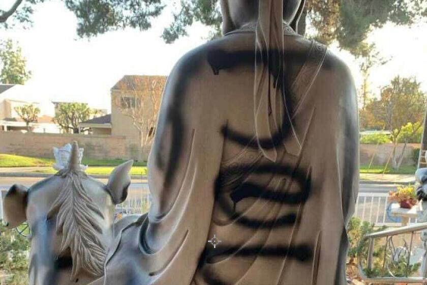 A Buddhist statue at Huong Tich Temple in Santa Ana was vandalized recently.
