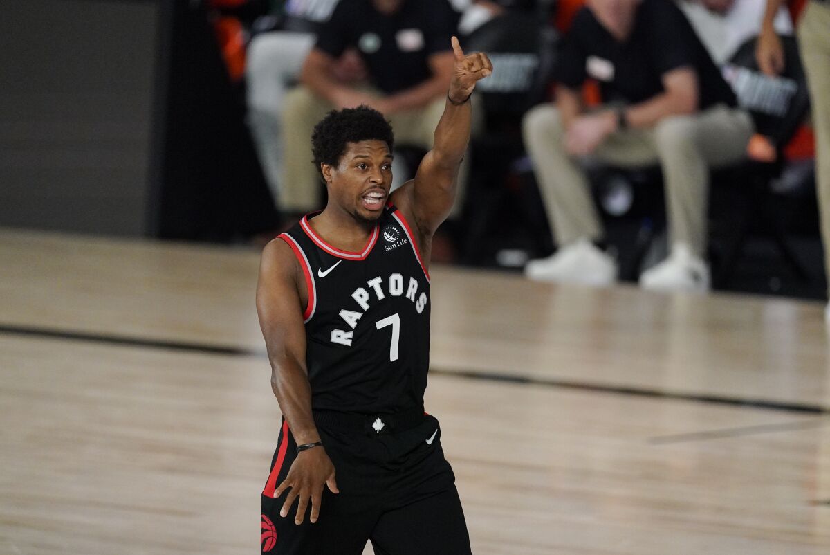 Toronto Raptors' Kyle Lowry (7) reacts during the first half of an NBA conference semifinal playoff basketball game against the Boston Celtics Saturday, Sept. 5, 2020, in Lake Buena Vista, Fla. (AP Photo/Mark J. Terrill)