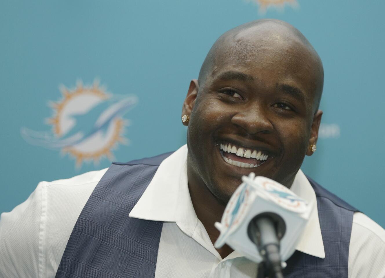 Laremy Tunsil smiles during a press conference at the Dolphins' facility a day after being drafted with the No. 13 overall pick.