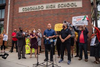 Andres Rivera speaks at a rally in front of Coronado High School.