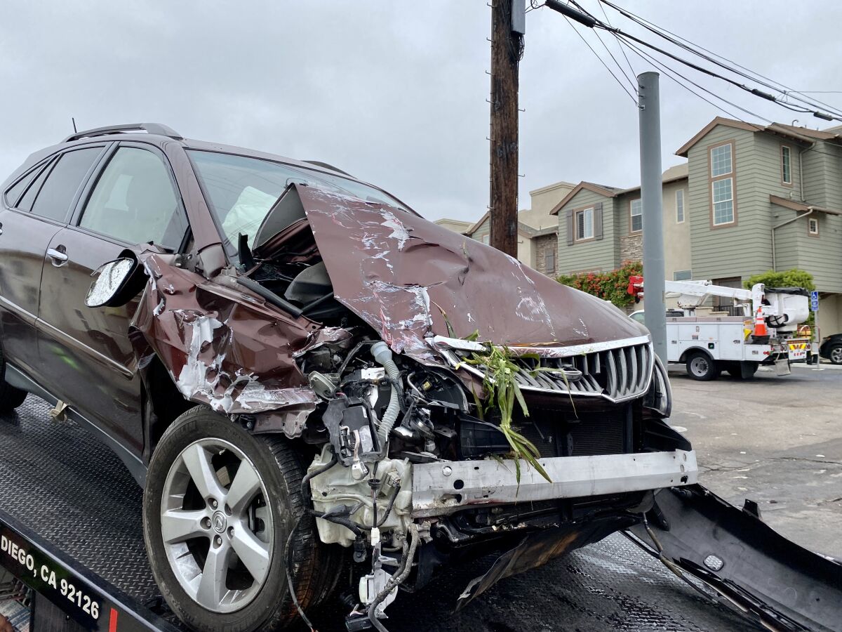 A 2008 Lexus RX 350 is removed from Harry's Coffee Shop after crashing into it May 12.