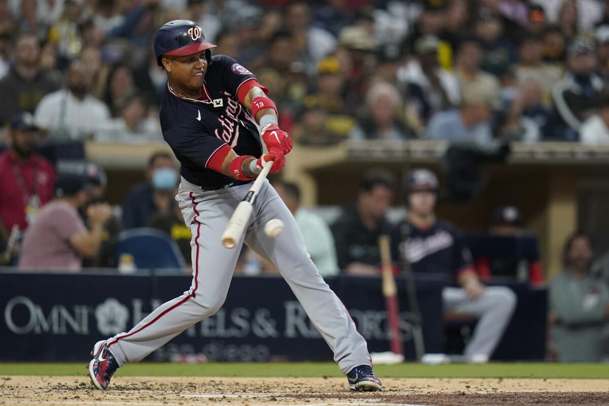 Washington Nationals' Starlin Castro hits a two-RBI single during the second inning of a baseball game against the San Diego Padres, Wednesday, July 7, 2021, in San Diego. (AP Photo/Gregory Bull)