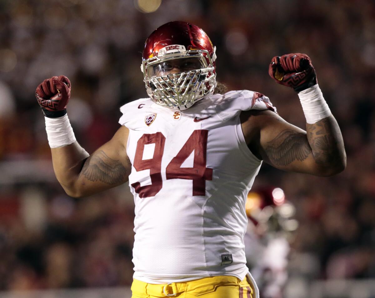 USC defensive lineman Leonard Williams celebrates a tackle against Utah on Oct. 25.