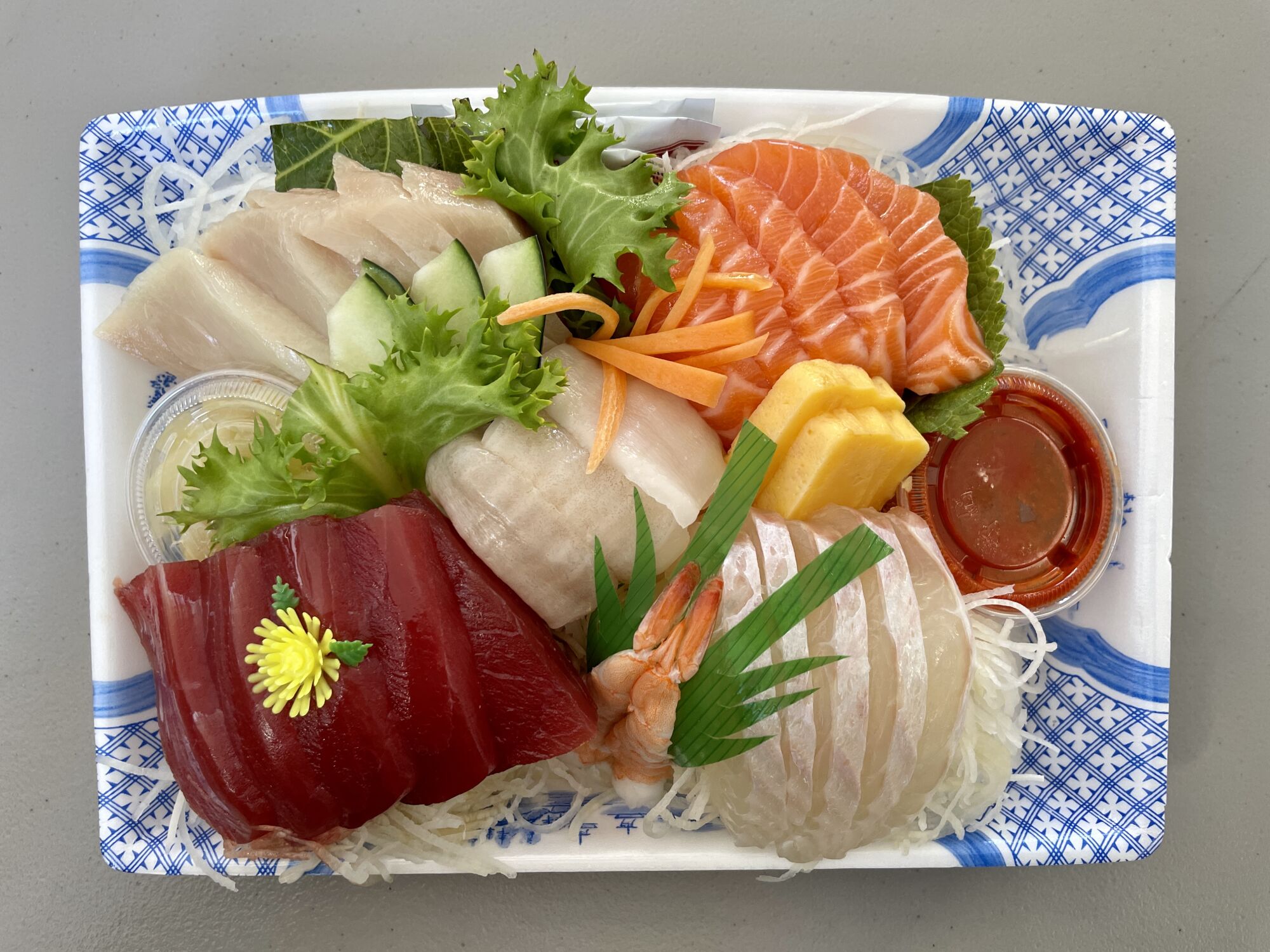 overhead view of a platter of raw fish