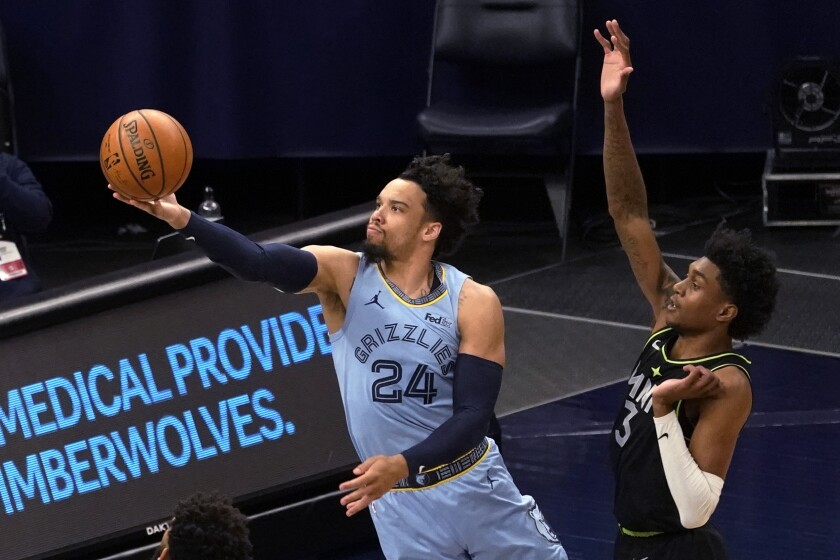 Memphis Grizzlies' Dillon Brooks (24) shoots past Minnesota Timberwolves' Jaden McDaniels (3) during the first half of an NBA basketball game Wednesday, May 5, 2021, in Minneapolis. (AP Photo/Jim Mone)