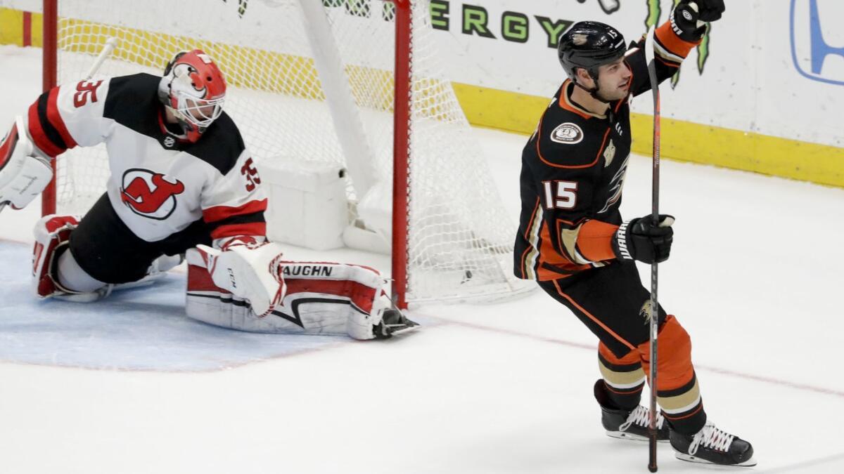 Ducks center Ryan Getzlaf celebrates after scoring the game-winning goal past Devils goaltender Cory Schneider during a shootout Sunday.