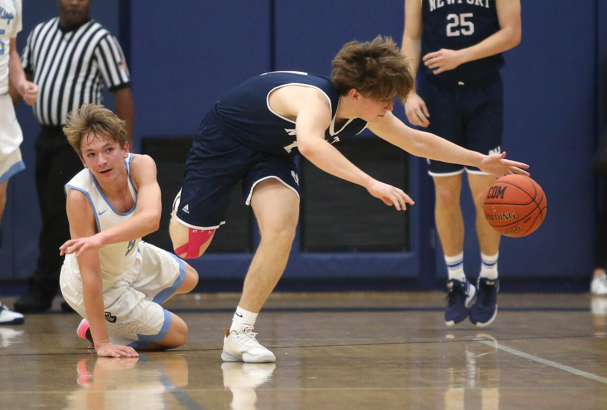 Newport Harbor's Levi Darrow catches up to a loose ball he knocked away from Corona del Mar's Jon Siegel, left, in the Battle of the Bay rivalry game on the road Friday.