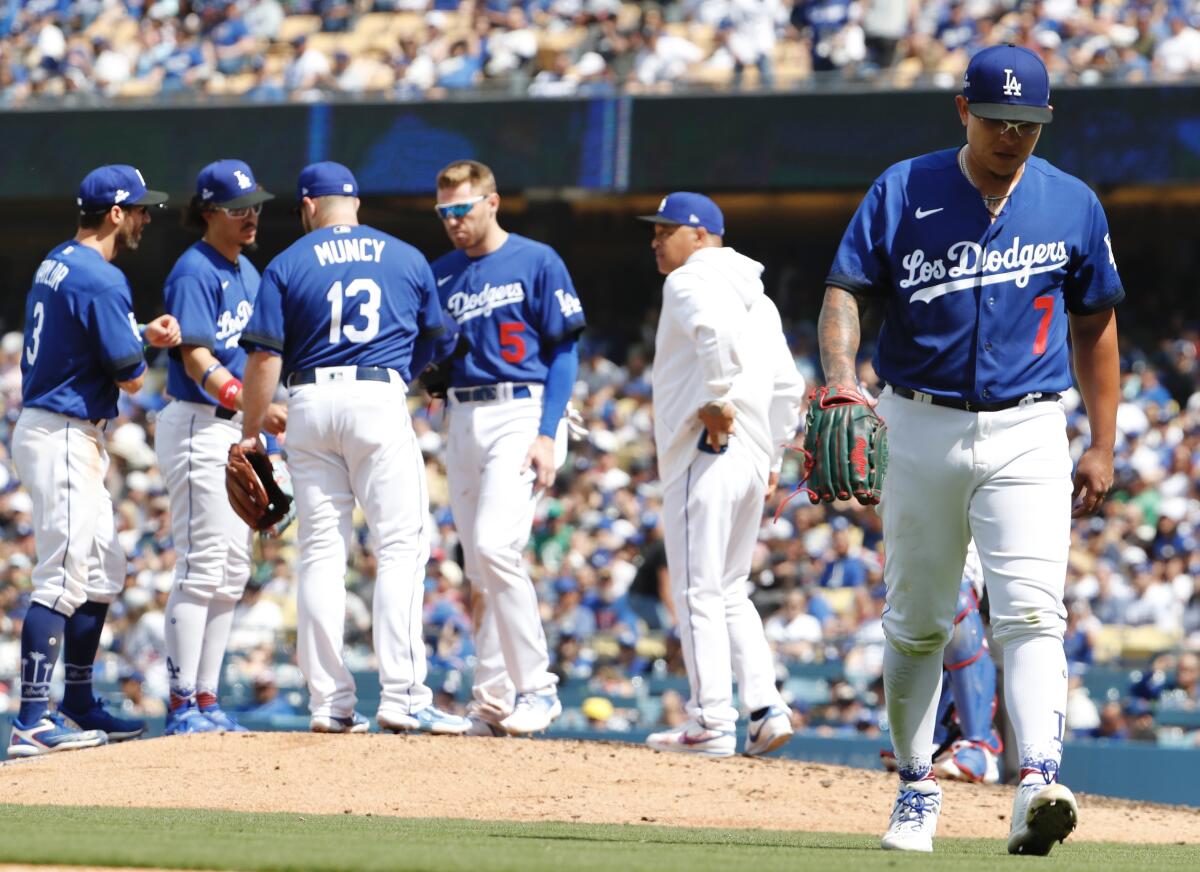 Dodgers pitcher Julio Urías walks to the dugout during a loss to the Chicago Cubs on April 16 at Dodger Stadium.