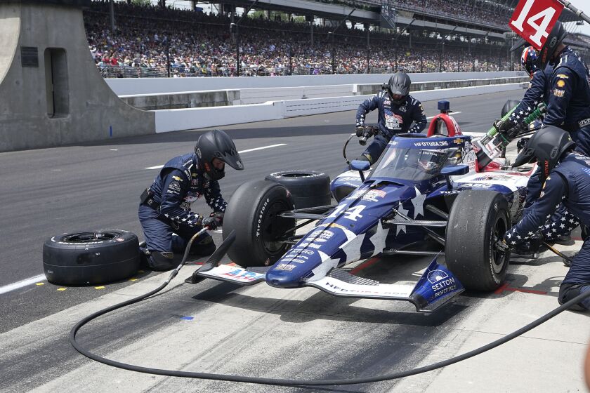Santino Ferrucci makes a pit stop during the Indianapolis 500 auto race at Indianapolis Motor Speedway, Sunday, May 28, 2023, in Indianapolis. (AP Photo/Darron Cummings)