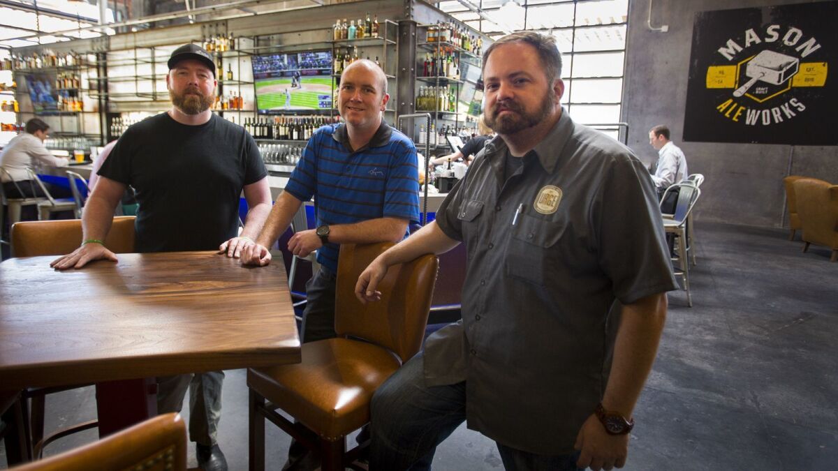 Brothers Zak Higson, left, his brother, Nate Higson, center, and Zak's longtime friend, Grant Tondro, right, inside their Urge Comon House in San Marcos. Their Three Local Brothers company plans to open a food hall anda BBQ restaurant in Poway in fall 2019.