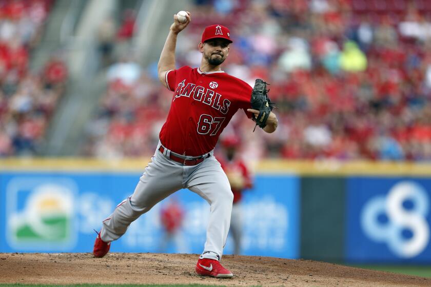 Los Angeles Angels starting pitcher Taylor Cole throws against the Cincinnati Reds during the first inning of a baseball game, Monday, Aug. 5, 2019, in Cincinnati. (AP Photo/Gary Landers)