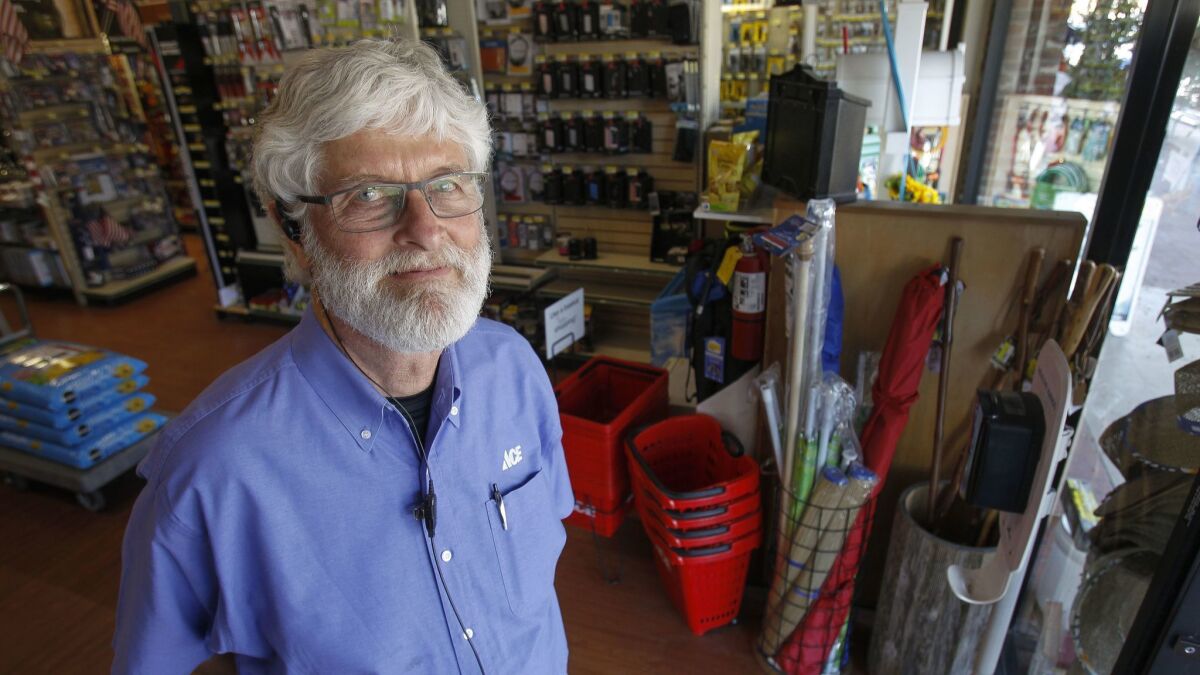 Bob Meanley in his family's La Jolla hardware store, now without its customary free popcorn. "I hate to take away something that our customers really like," he said.