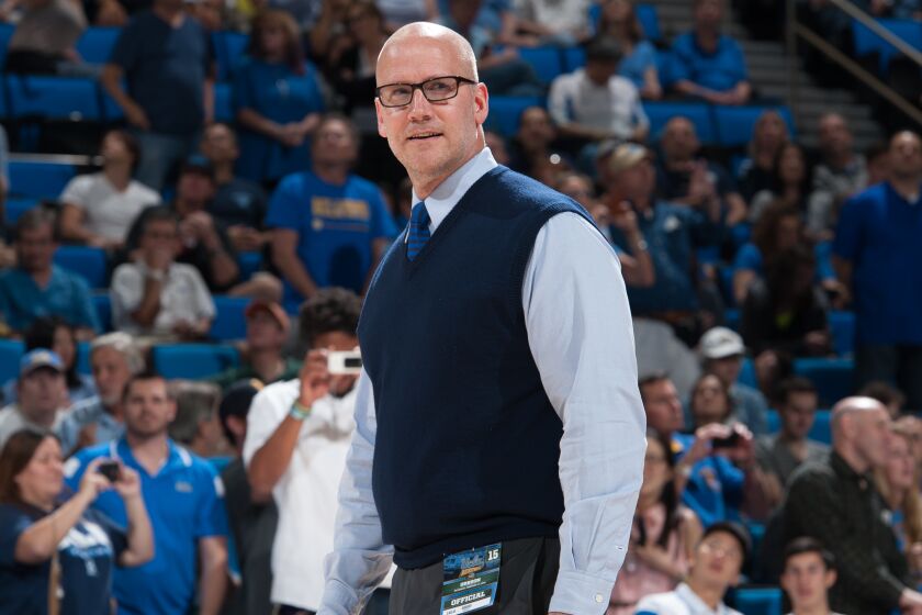 Doug Erickson, UCLA's director of basketball administration, walks on the court at Pauley Pavilion during a game between UCLA and Oregon on Feb. 14, 2015.