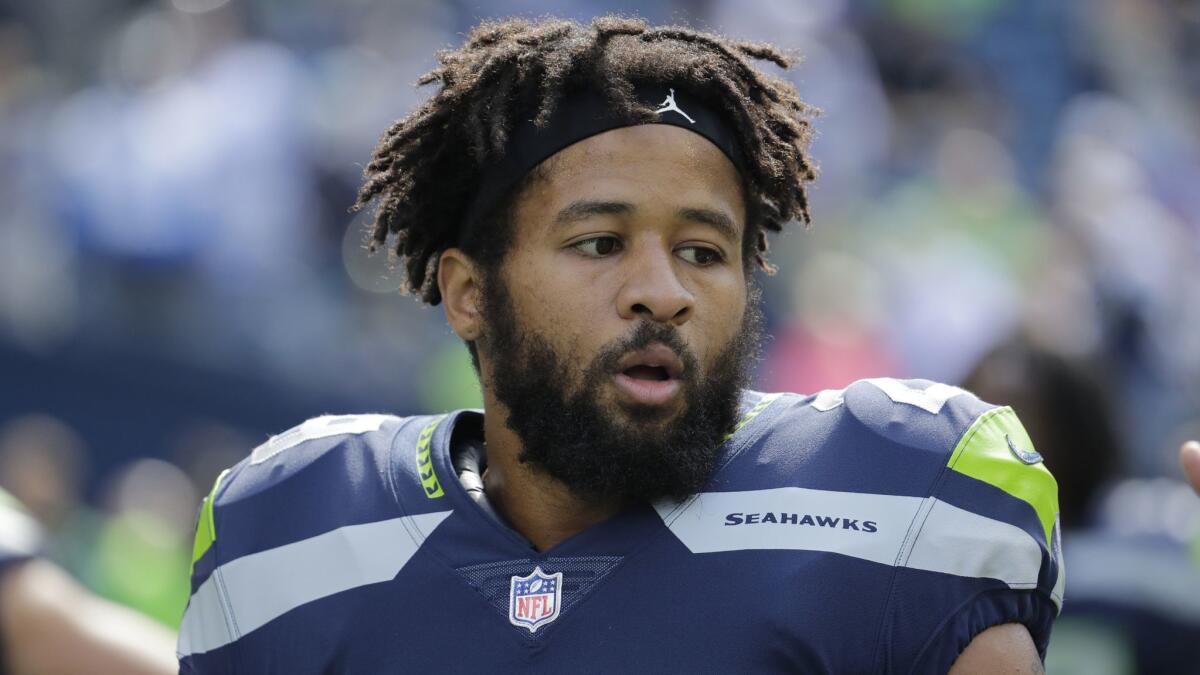 Seattle Seahawks free safety Earl Thomas stands on the field during warmups before a game against the Dallas Cowboys on Sept. 23.