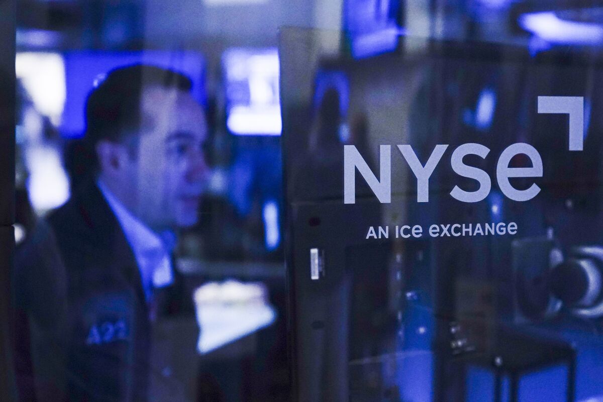 Traders work on the floor at the New York Stock Exchange.