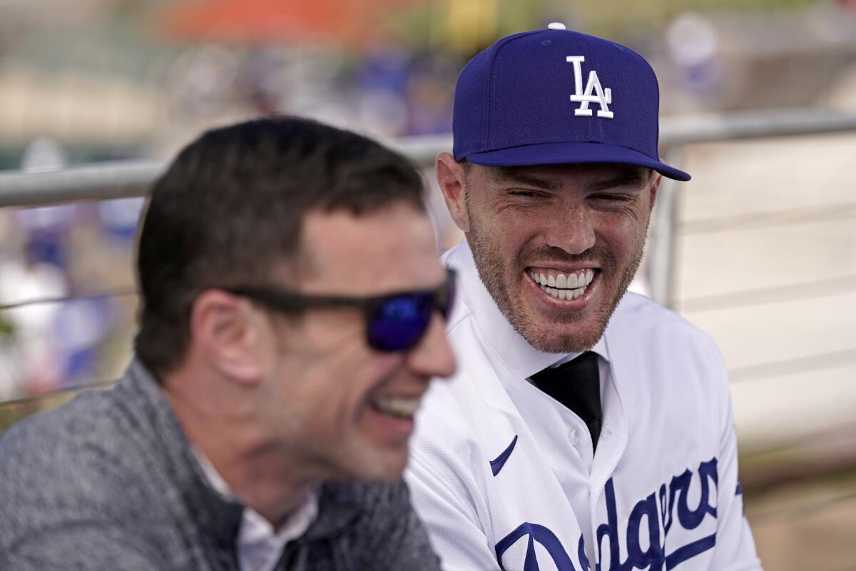 Andrew Friedman, the Dodgers' president of baseball operations, shares a laugh with Freddie Freeman.