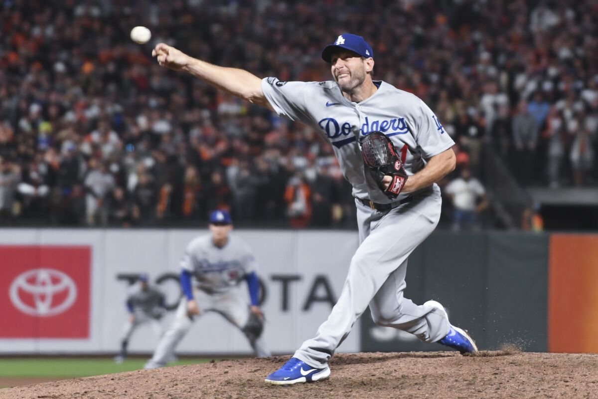 Dodgers starting pitcher Max Scherzer delivers a pitch against the San Francisco Giants in Game 5 of the NLDS.