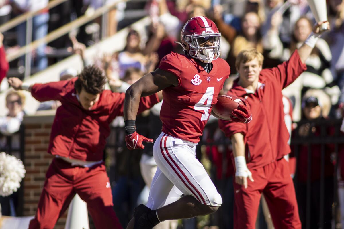 Alabama running back Brian Robinson Jr. (4) runs the ball for a touchdown against New Mexico State during the first half of an NCAA college football game, Saturday, Nov. 13, 2021, in Tuscaloosa, Ala. (AP Photo/Vasha Hunt)