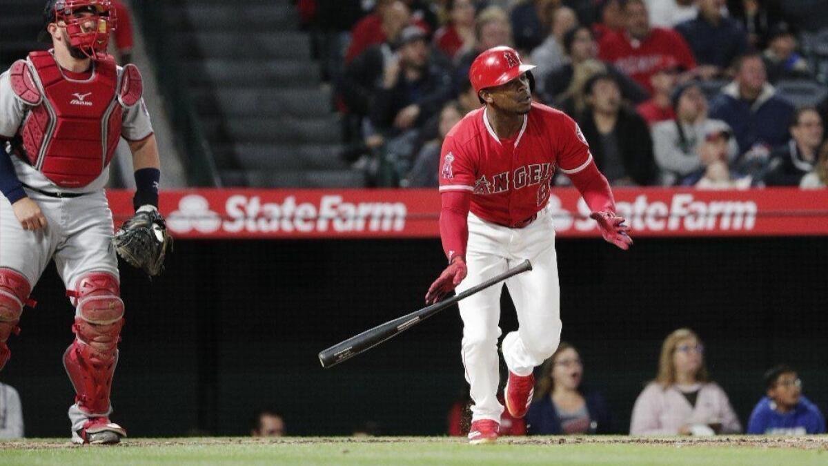 Angels outfielder Justin Upton drops his bat after hitting a two-run home run against the Twins during the third inning of a game Friday at Angel Stadium.
