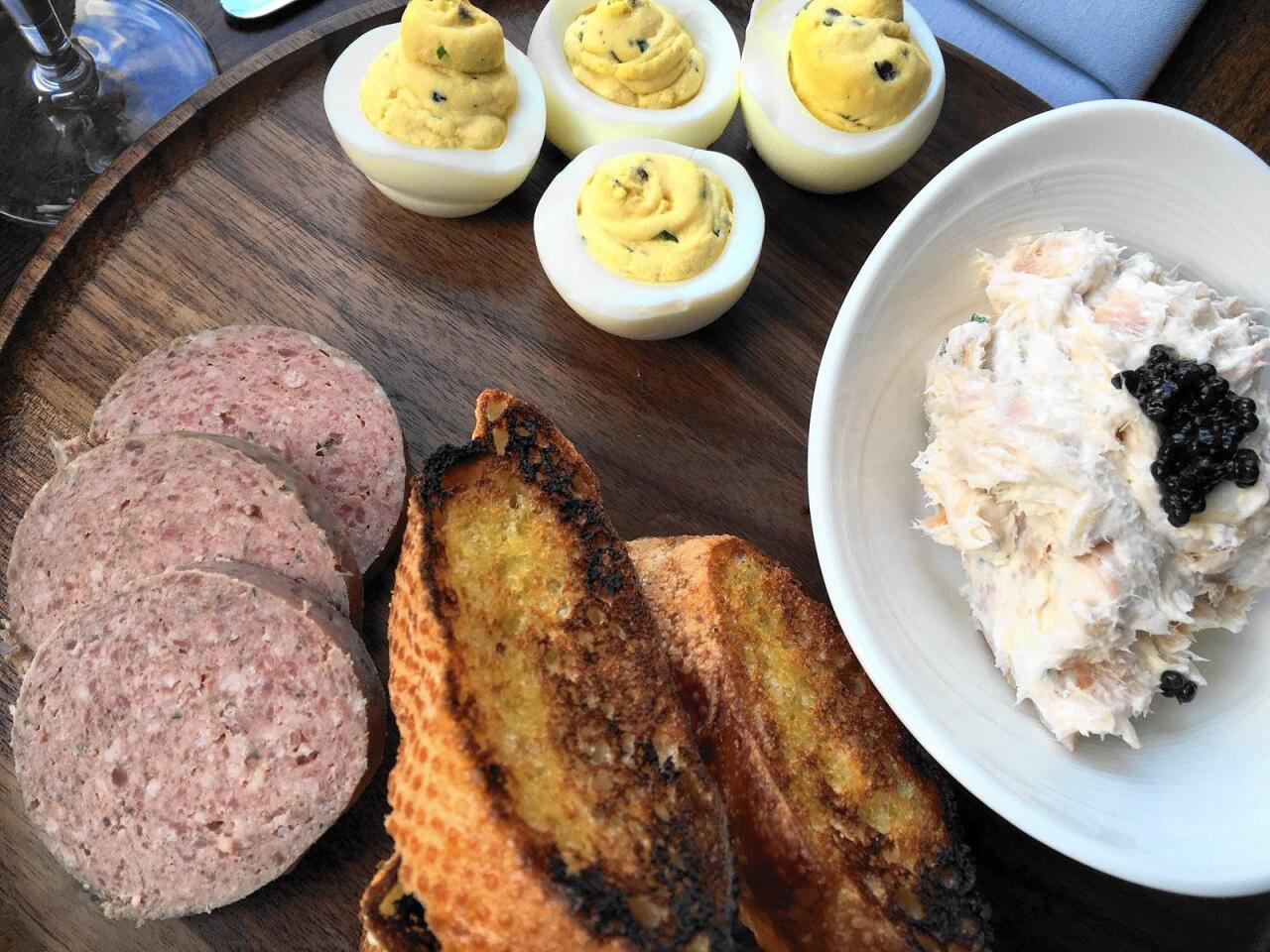 Lazy Susan choices at Supper in Milwaukee include housemade braunschweiger, smoked trout mousse and black truffle deviled eggs.
