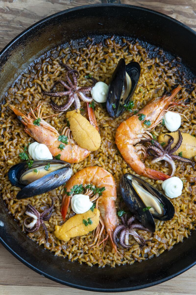 Mariscos Paella with prawns, mussels, squid, lobster fumet, sherry aioli at Otono Thursday, Sept. 20, 2018, Los Angeles