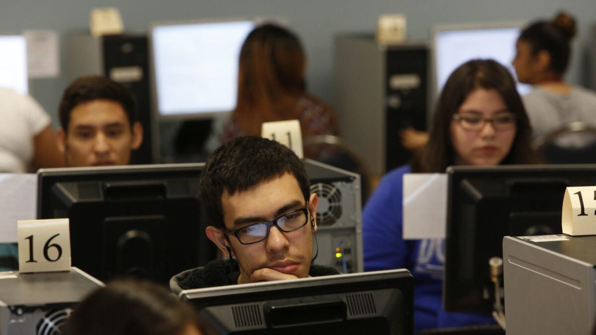 Students at Bravo Medical Magnet High School in Los Angeles practice for state standardized tests in 2015. The state released the latest test results on Tuesday.