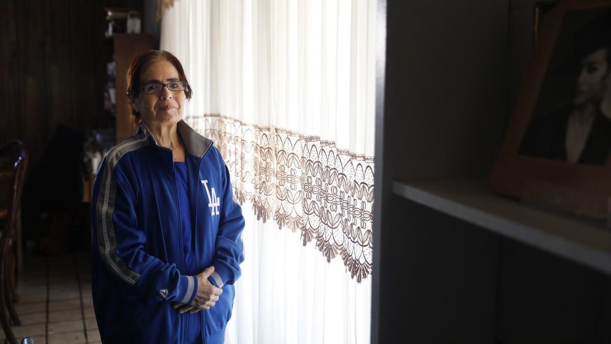 Maria Hartmark, the longtime dining room manager for the press box at Dodger Stadium, is photographed at home in Carson. Hartmark was struck by a car and journalists who cover the team rallied around her as she recovers.