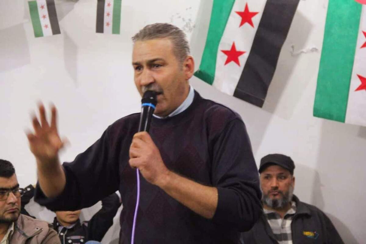 Talal Al-Loush speaks at an opposition event in Idlib 