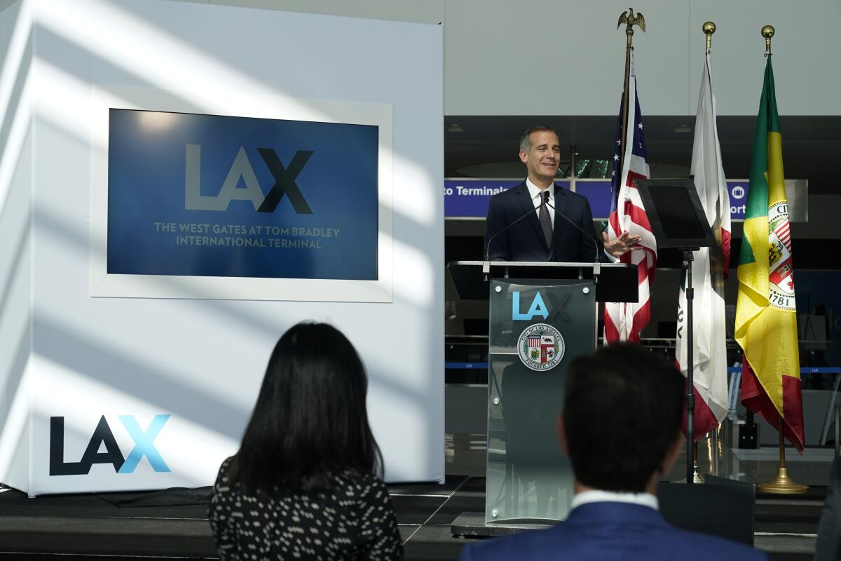 Los Angeles Mayor Eric Garcetti at a podium