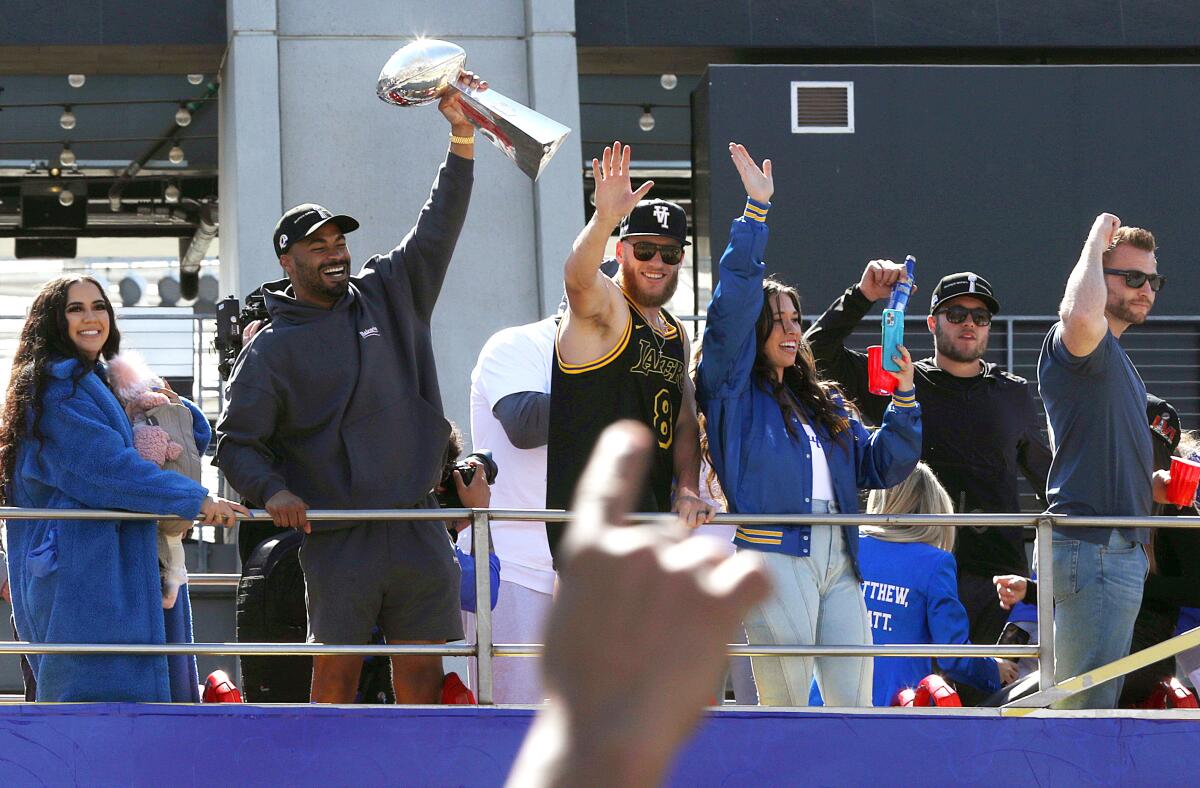 Robert Woods, Cooper Kupp, Matthew Stafford, and coach Sean McVay celebrate during the Rams’ victory parade.