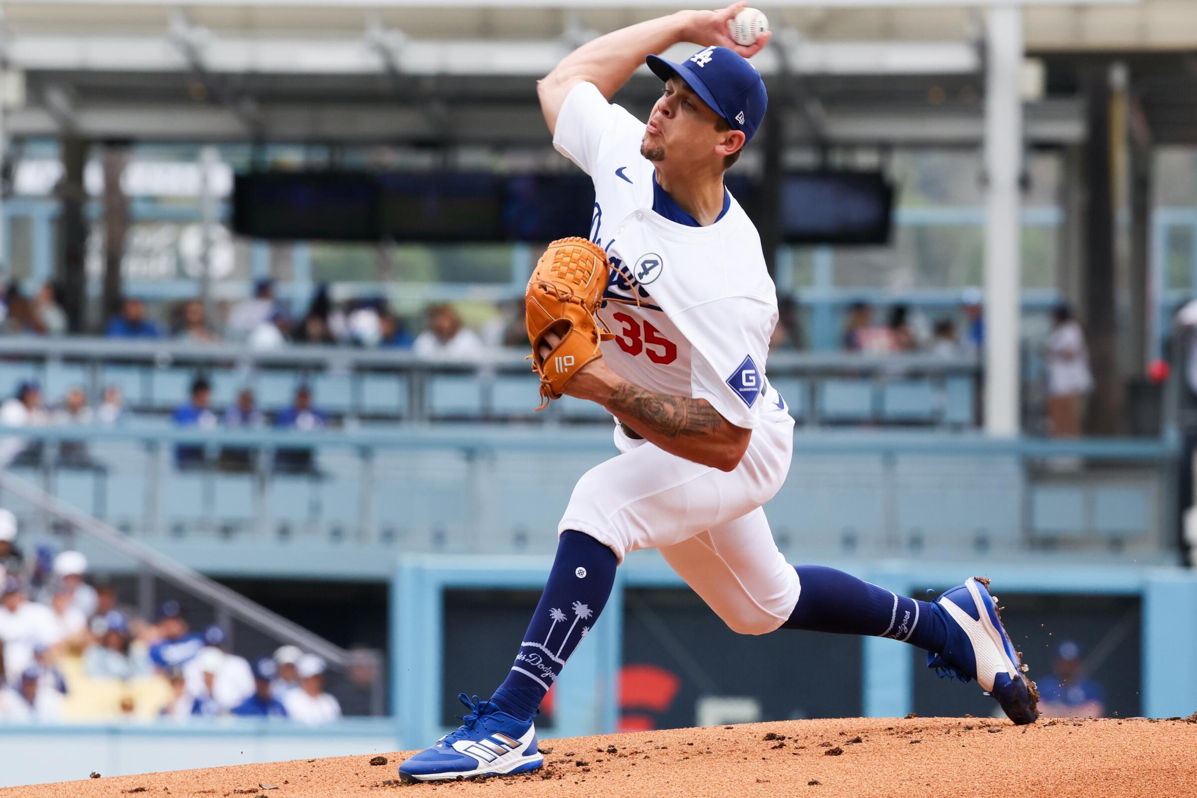 Dodgers pitcher Gavin Stone delivers a pitch against the Rockies.