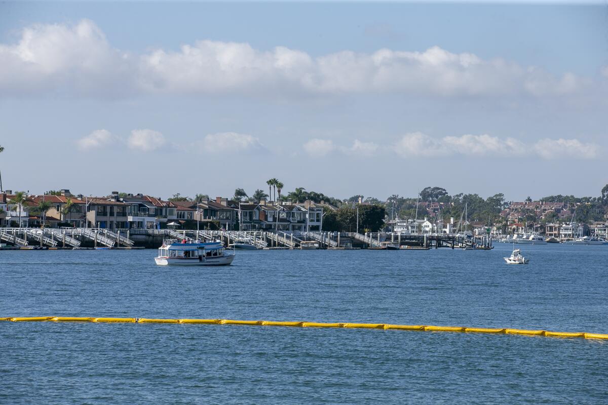 A boom stretches across the mouth of Newport Harbor.