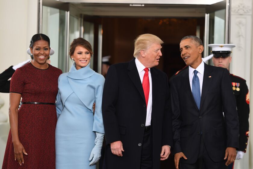 US President Barack Obama(R) and First Lady Michelle Obama(L) welcome Preisdent-elect Donald Trump(2nd-R) and his wife Melania to the White House in Washington, DC January 20, 2017. / AFP / JIM WATSON (Photo credit should read JIM WATSON/AFP via Getty Images)