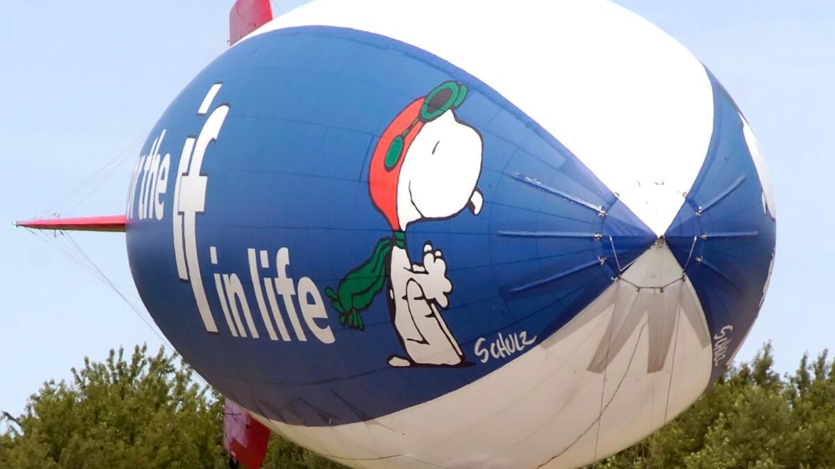 The MetLife Snoopy Two blimp comes in for a landing at the Park Township Airport in Holland, Mich. in 2007.