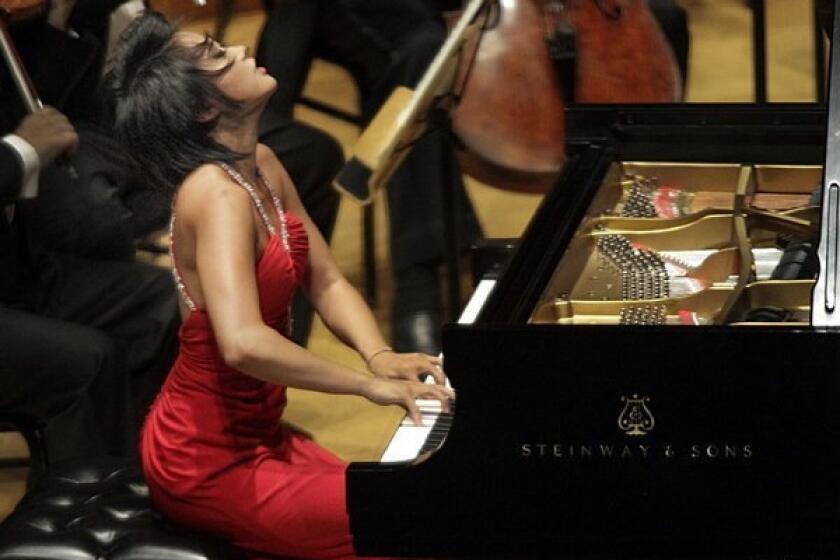 Pianist Yuja Wang, shown last year at Walt Disney Concert Hall, will perform in Orange County for the 2013-14 season of the Philharmonic Society.
