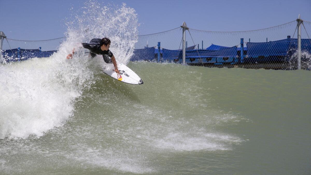 Kanoa Igarashi, of Huntington Beach, does a turn high off the top of the 700-yard, high-performance, bi-directional wave at Kelly Slater's Surf Ranch, which is hosting its first World Surfing League competition.