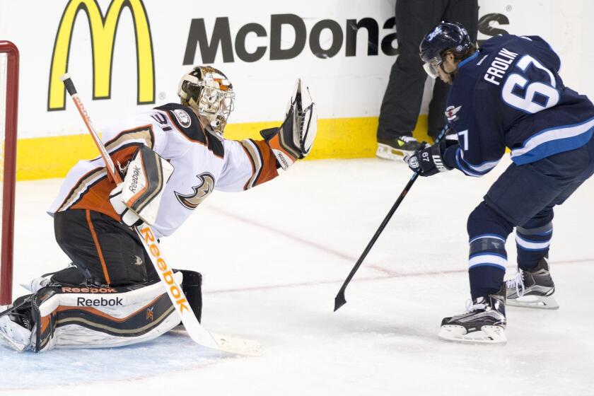Ducks goalie Frederik Andersen denies Winnipeg right wing Michael Frolik on Monday.