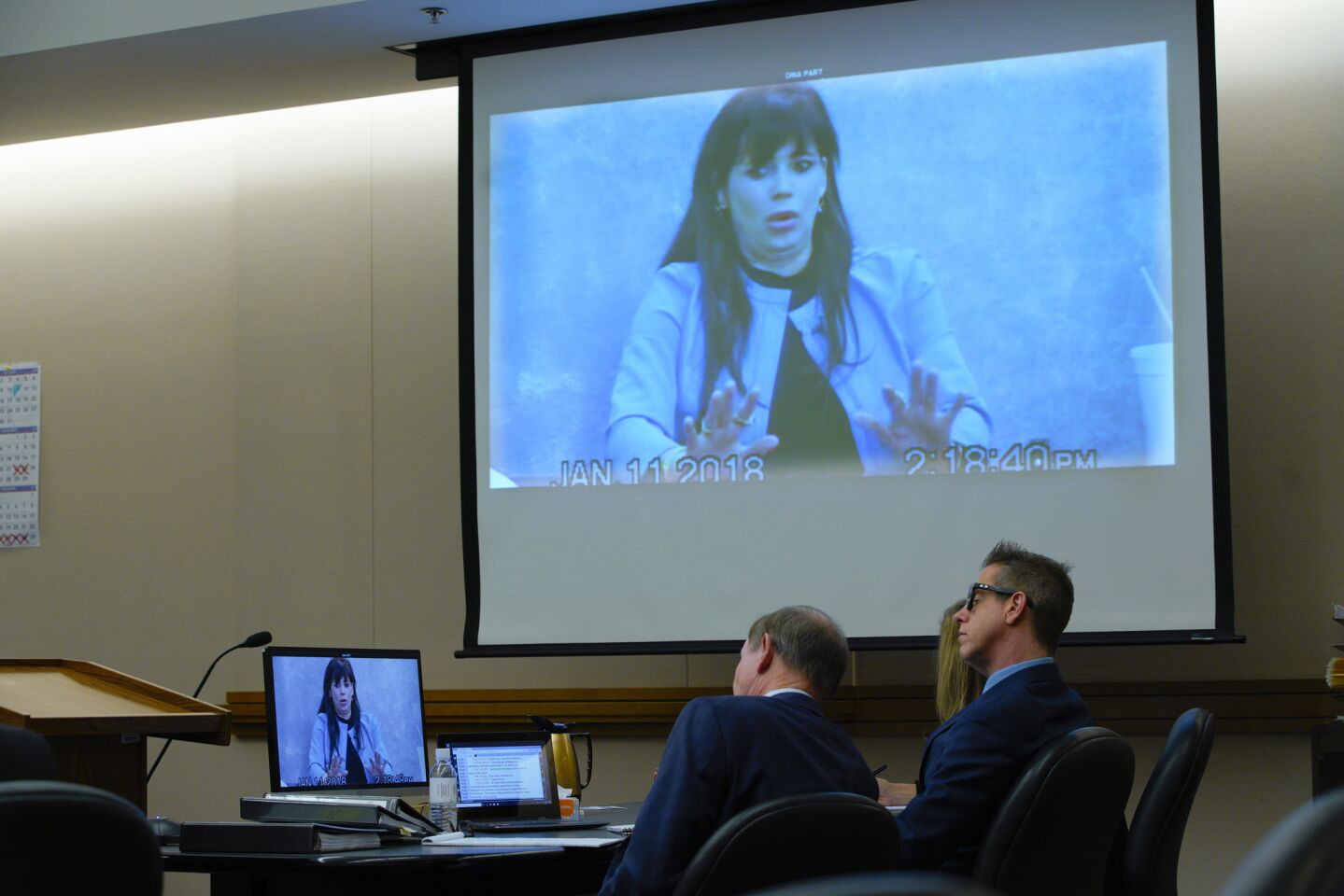 Adam Shacknai and his attorneys, Dan Webb (left) and Krista M. Enns watched the video deposition of Dina Shacknai taken on January 11, 2018 as it is played in court during the civil trial for the wrongful death of Rebecca Zahau in San Diego Superior Court.