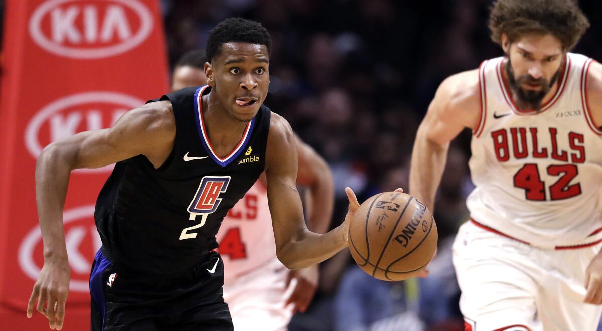 Clippers guard Shai Gilgeous-Alexander starts a fast break against the Bulls during a 128-121 victory on Friday night.