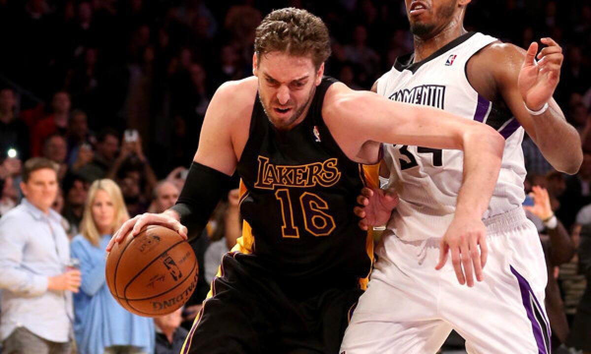 Lakers center Pau Gasol, left, drives past Sacramento Kings forward Jason Thompson during the Lakers' win Friday. Gasol says sometimes it's necessary to get angry in order for a team to make a positive response.