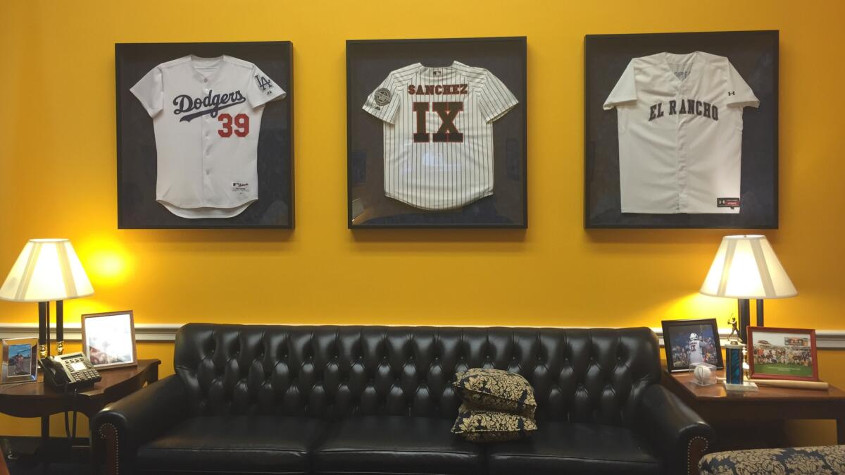 Some of Linda Sanchez's jerseys hang on her office wall. (Sarah D. Wire / Los Angeles Times)