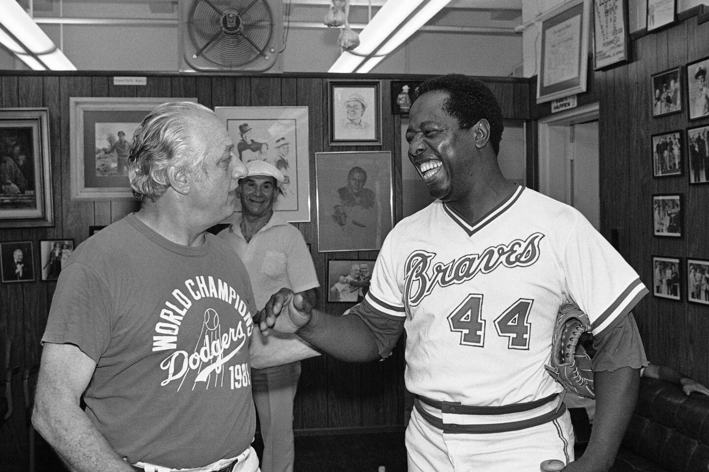 Hank Aaron, right, jokes with Los Angeles Dodgers manager Tommy Lasorda