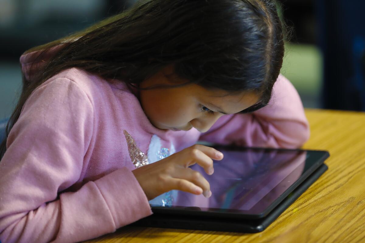 Perkins Elementary student works on a laptop