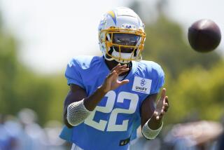 Chargers safety/corner JT Woods (22) catches a pass during drills.