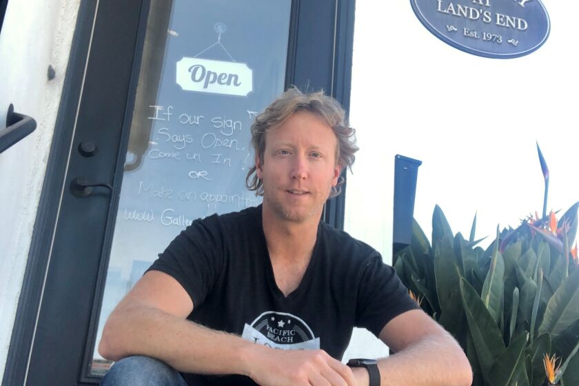Thayne Yungman at his Pacific Beach shop, Gallery at Land's End, which has framing services as well as gifts and goods made by local artists and makers.