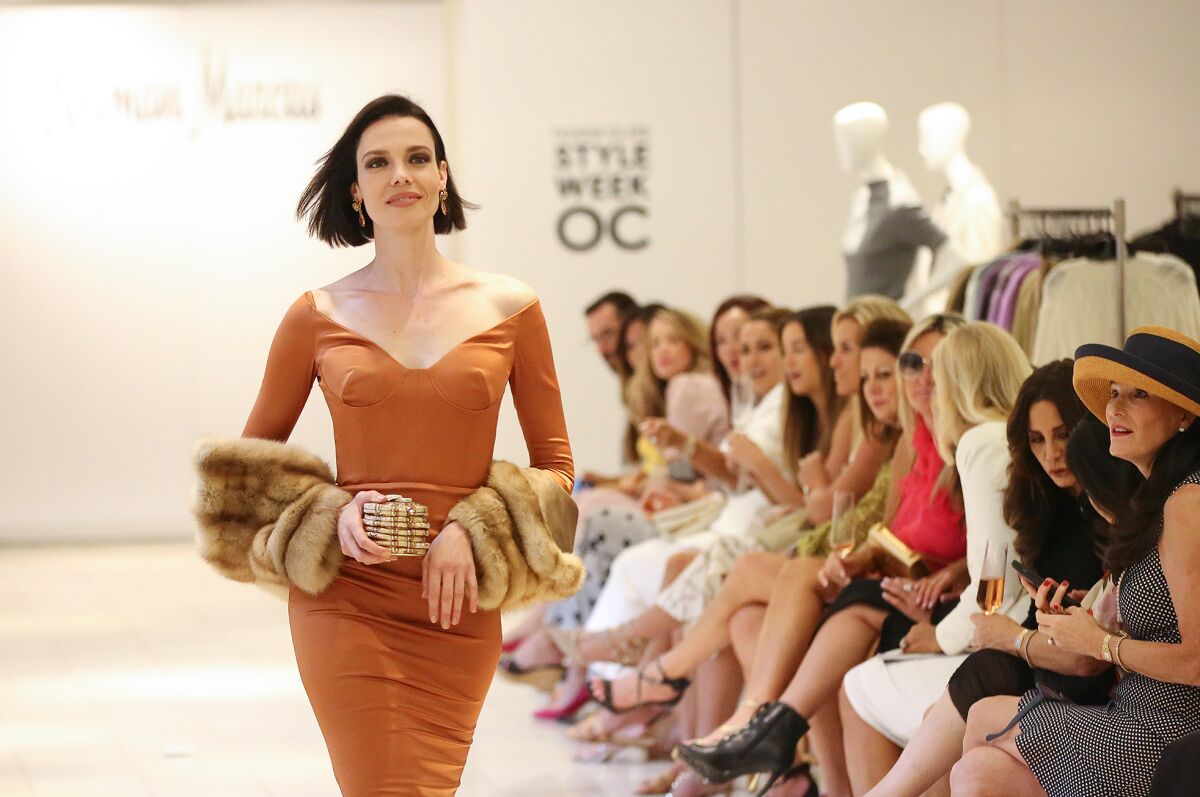 A model wearing walks the runway.