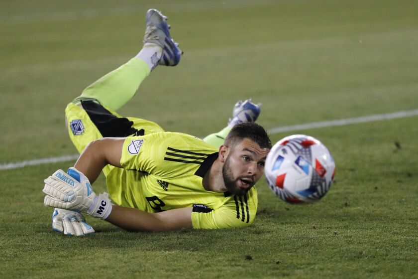 Vancouver Whitecaps goalkeeper Maxime Crepeau (16) reacts as he attempts to make a save.