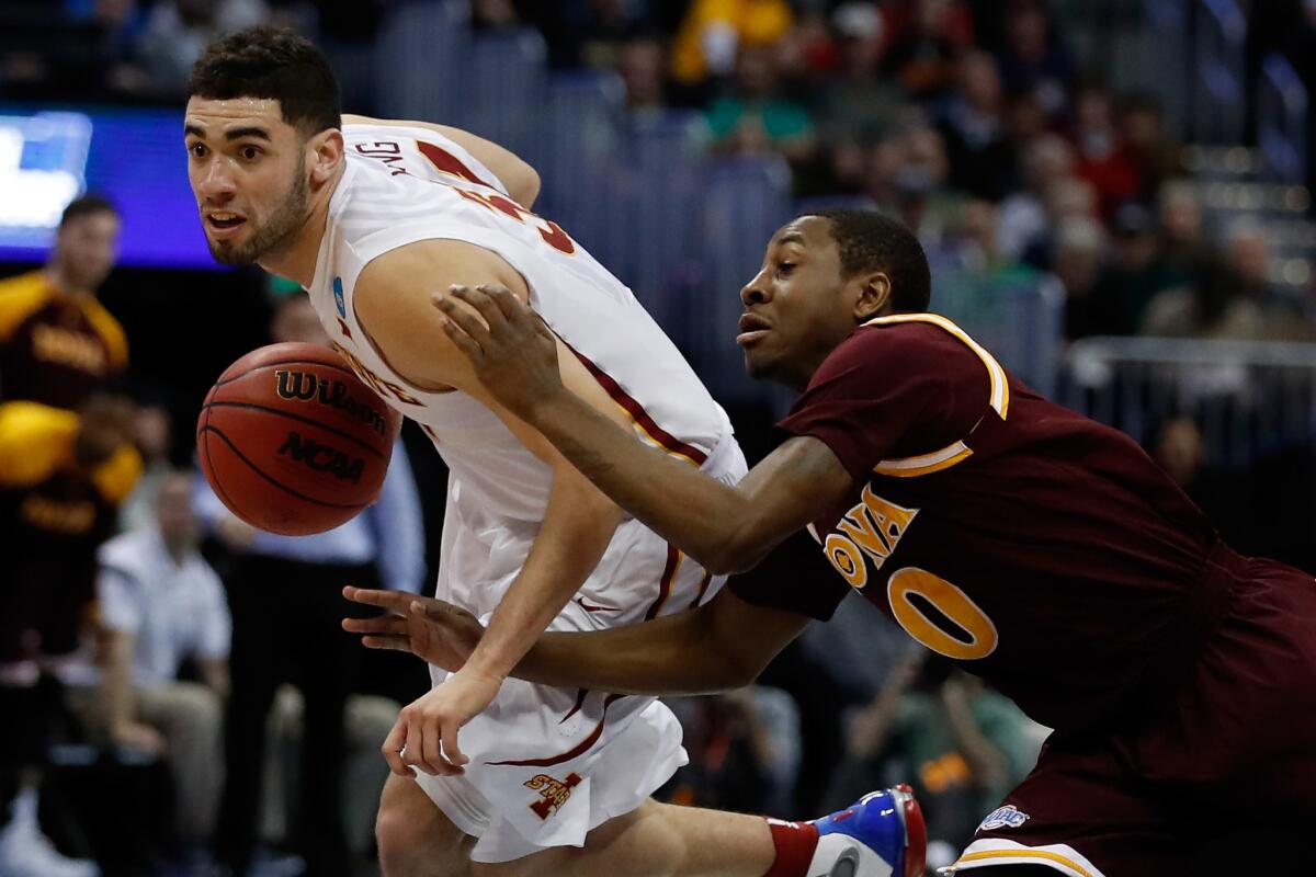 Iowa State's Georges Niang gets past Iona's Rickey McGill.